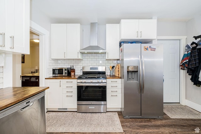 141 W 400 N, Logan, UT 84321 - kitchen featuring stainless steel appliances, butcher block countertops, wall chimney exhaust hood, dark wood-style flooring, and decorative backsplash