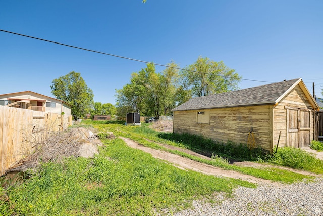 141 W 400 N, Logan, UT 84321 - view of yard with a storage unit, an outbuilding, and fence