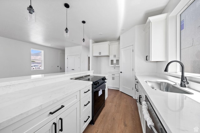 295 N 1580 W Unit 101, Pleasant Grove, UT 84062 - kitchen featuring black / electric stove, wood finished floors, light stone countertops, and white cabinetry