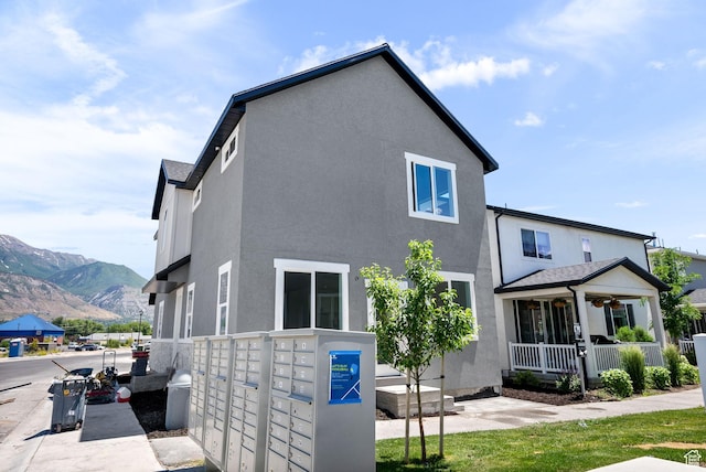 295 N 1580 W Unit 101, Pleasant Grove, UT 84062 - rear view of property featuring stucco siding and a mountain view