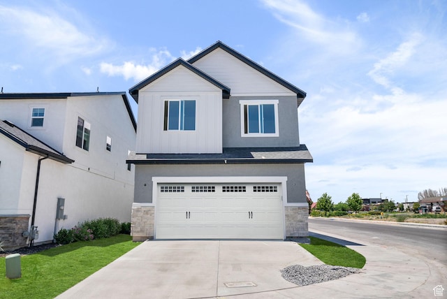 295 N 1580 W Unit 101, Pleasant Grove, UT 84062 - view of front facade with stone siding, driveway, an attached garage, board and batten siding, and roof with shingles