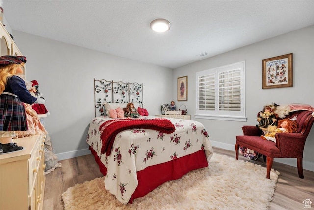 10539 S Haven View Ct W, South Jordan, UT 84095 - bedroom featuring light wood-style floors and baseboards