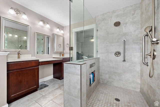 10539 S Haven View Ct W, South Jordan, UT 84095 - bathroom with a tile shower, vanity, and tile patterned flooring