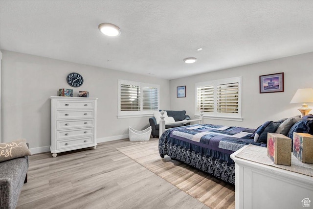 10539 S Haven View Ct W, South Jordan, UT 84095 - bedroom with light wood finished floors, a textured ceiling, and baseboards