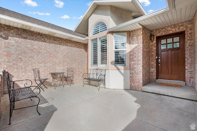 10539 S Haven View Ct W, South Jordan, UT 84095 - doorway to property featuring brick siding and stucco siding