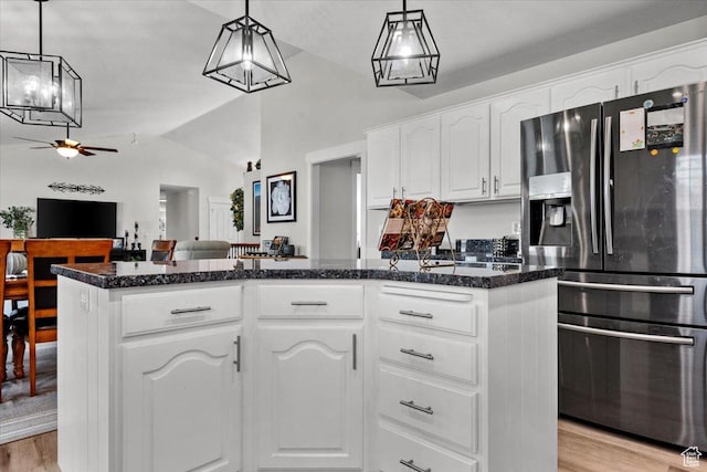10539 S Haven View Ct W, South Jordan, UT 84095 - kitchen with stainless steel refrigerator with ice dispenser, a ceiling fan, vaulted ceiling, light wood finished floors, and dark stone counters
