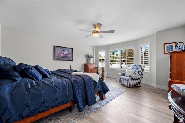 10539 S Haven View Ct W, South Jordan, UT 84095 - bedroom with light wood finished floors, baseboards, and a ceiling fan