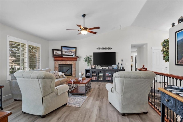 10539 S Haven View Ct W, South Jordan, UT 84095 - living area with vaulted ceiling, a ceiling fan, a fireplace, and wood finished floors