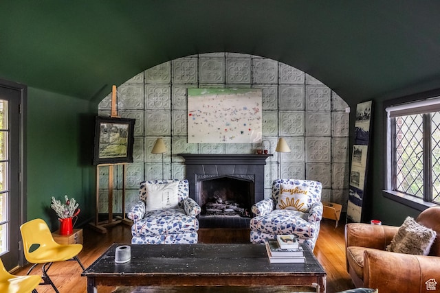 1677 E Yalecrest Ave, Salt Lake City, UT 84105 - living room with wood finished floors, vaulted ceiling, and a fireplace
