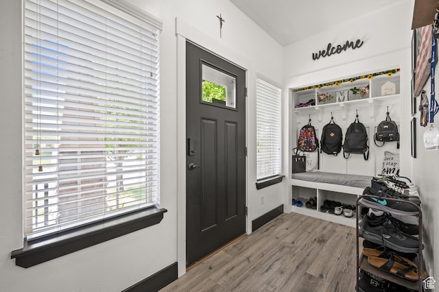 mudroom featuring wood finished floors and baseboards