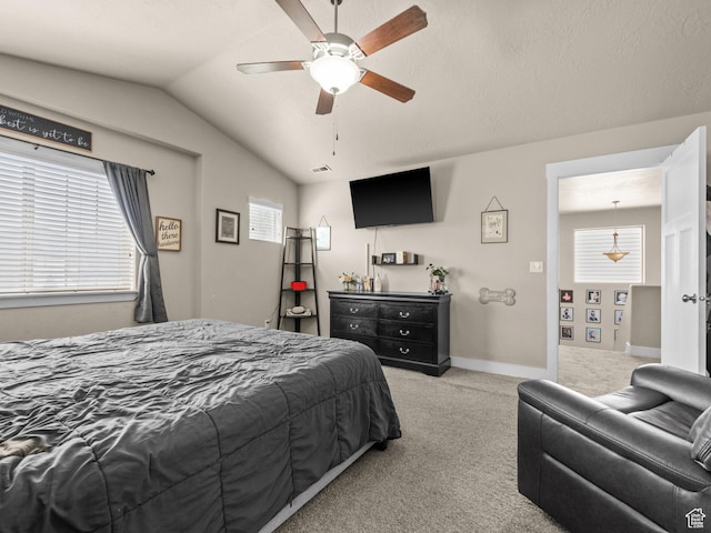 bedroom with carpet, lofted ceiling, a ceiling fan, and baseboards