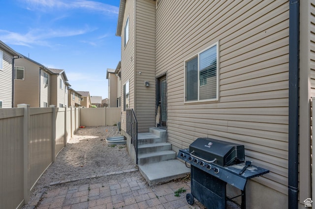 view of patio / terrace with grilling area and a fenced backyard