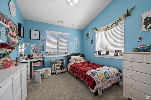 carpeted bedroom featuring vaulted ceiling and a ceiling fan