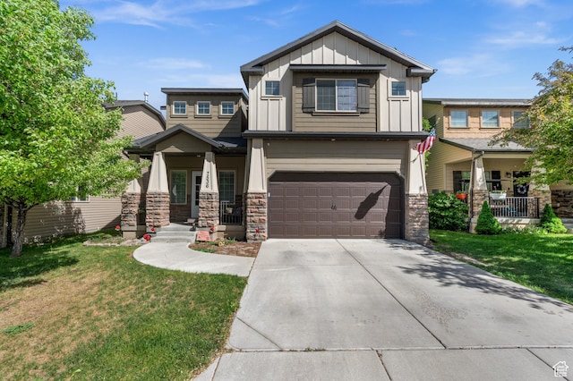 craftsman inspired home with covered porch, board and batten siding, a garage, and a front lawn