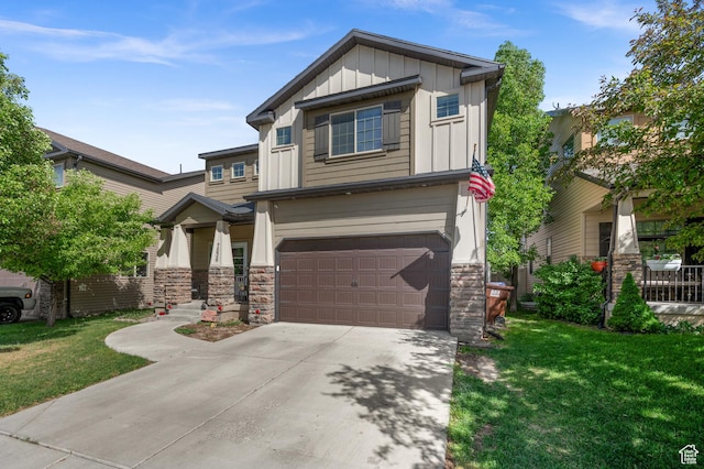 craftsman house with board and batten siding, stone siding, a garage, and a front yard