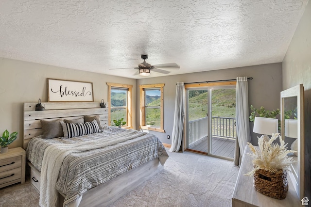 2013 N River View Cir, Huntsville, UT 84317 - bedroom with access to outside, carpet, a textured ceiling, ceiling fan, and baseboards