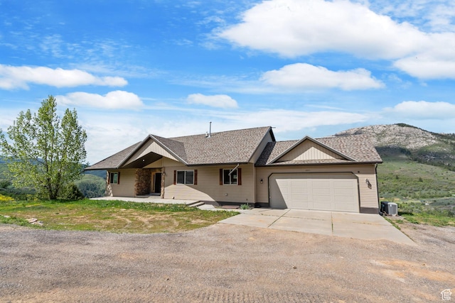 2013 N River View Cir, Huntsville, UT 84317 - ranch-style home with concrete driveway, an attached garage, cooling unit, a mountain view, and roof with shingles