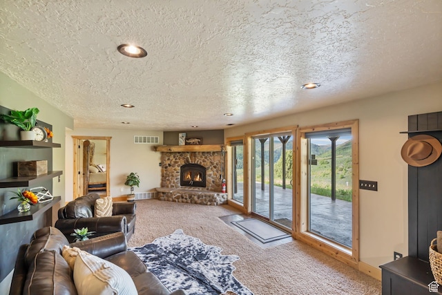 2013 N River View Cir, Huntsville, UT 84317 - carpeted living area with a stone fireplace, a textured ceiling, recessed lighting, and baseboards