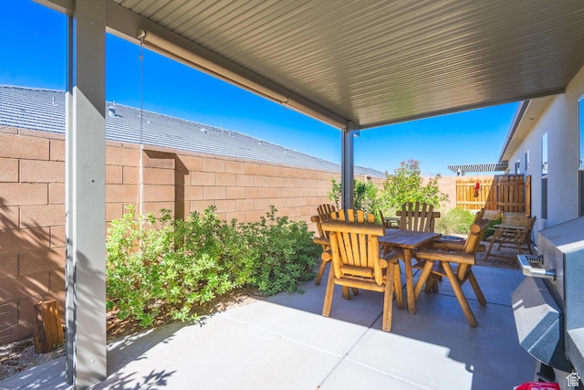 view of patio / terrace featuring outdoor dining space and a fenced backyard