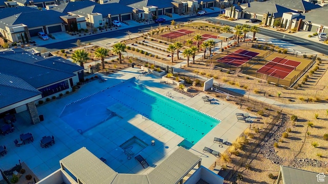 aerial view of residential area featuring a pool