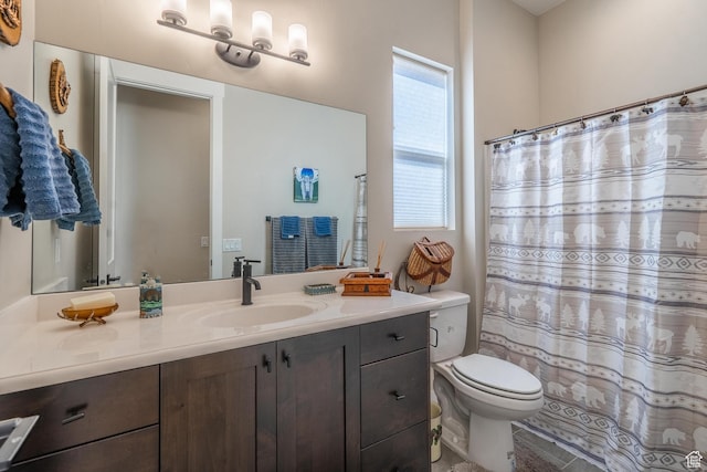 full bathroom featuring toilet, vanity, and curtained shower