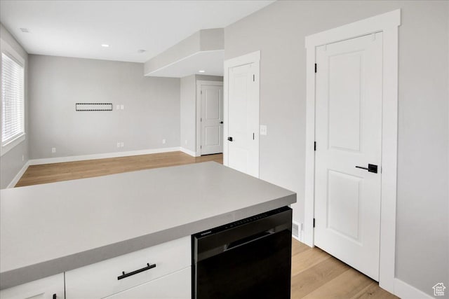 91 E 8000 S, Midvale, UT 84070 - kitchen with dishwasher, light wood-style flooring, baseboards, white cabinetry, and recessed lighting