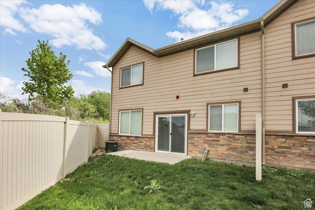91 E 8000 S, Midvale, UT 84070 - back of property featuring stone siding and a patio area
