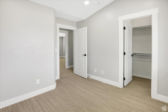 91 E 8000 S, Midvale, UT 84070 - unfurnished bedroom with light carpet, a walk in closet, baseboards, a closet, and recessed lighting