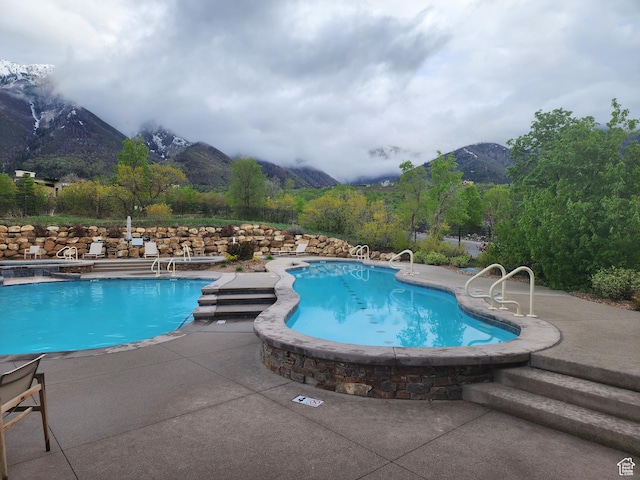 732 S Nebo Cir, Woodland Hills, UT 84653 - community pool with a mountain view and a patio area