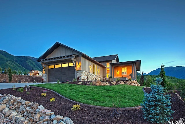 732 S Nebo Cir, Woodland Hills, UT 84653 - view of front of property with a mountain view, a garage, stone siding, and a front yard