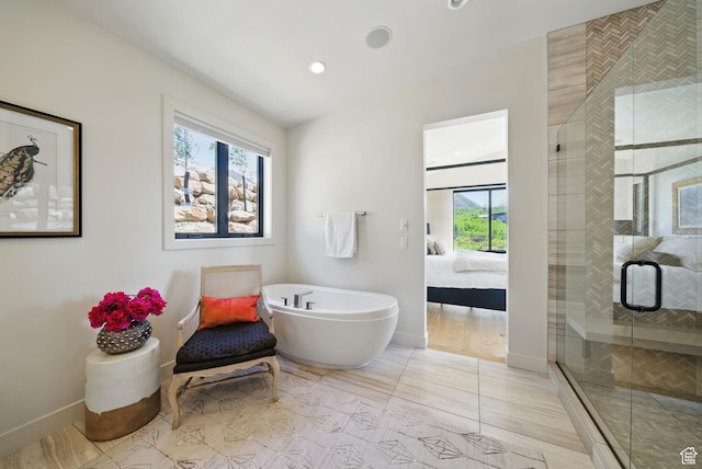 732 S Nebo Cir, Woodland Hills, UT 84653 - bathroom with connected bathroom, baseboards, a stall shower, a soaking tub, and recessed lighting