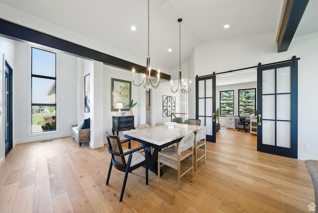 732 S Nebo Cir, Woodland Hills, UT 84653 - dining area featuring a barn door, a chandelier, recessed lighting, light wood finished floors, and high vaulted ceiling
