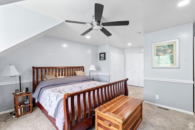 carpeted bedroom with multiple closets, recessed lighting, baseboards, and a ceiling fan