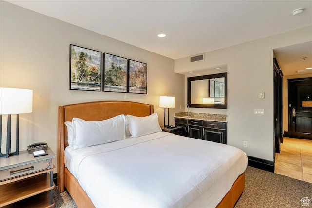 bedroom with recessed lighting