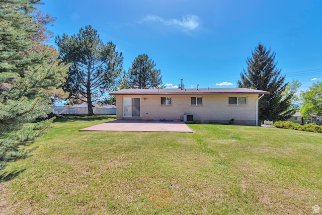 274 N 400 E, Hyde Park, UT 84318 - rear view of property featuring a patio area, cooling unit, and brick siding