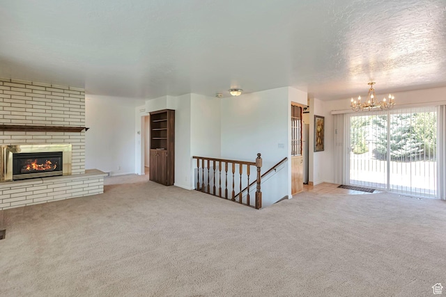 274 N 400 E, Hyde Park, UT 84318 - unfurnished living room featuring a chandelier, carpet flooring, a fireplace, and baseboards