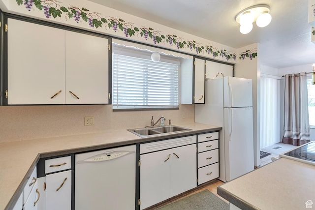 274 N 400 E, Hyde Park, UT 84318 - kitchen featuring white appliances, a sink, light countertops, and white cabinetry