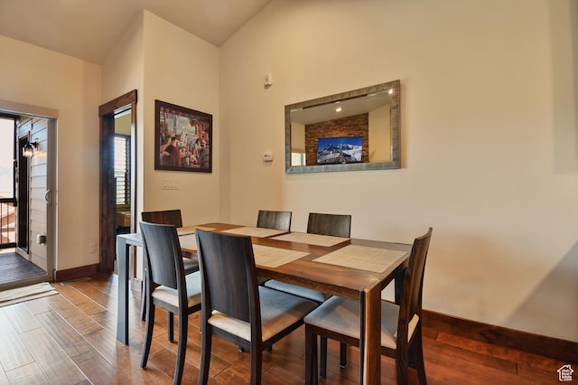 dining room with baseboards and wood finished floors
