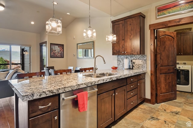kitchen with washer / clothes dryer, dishwasher, a sink, a peninsula, and lofted ceiling