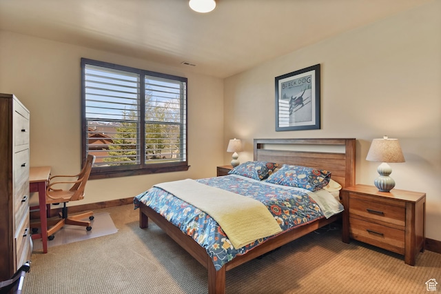 bedroom with carpet, baseboards, and a desk