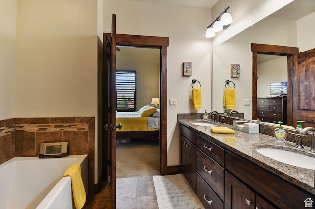 bathroom featuring a bath, double vanity, tile patterned flooring, and connected bathroom