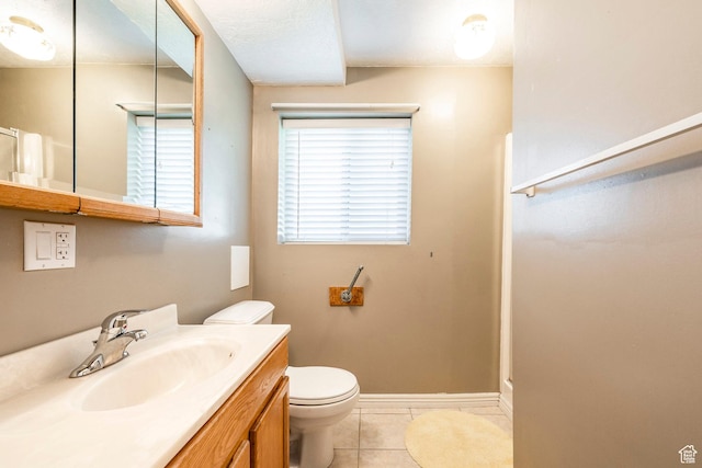 full bath featuring tile patterned flooring, toilet, vanity, and baseboards