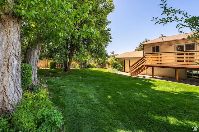 view of yard featuring stairway and a wooden deck