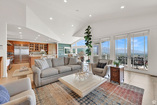 1274 E Chandler, Salt Lake City, UT 84103 - living area featuring vaulted ceiling, recessed lighting, and light tile patterned floors