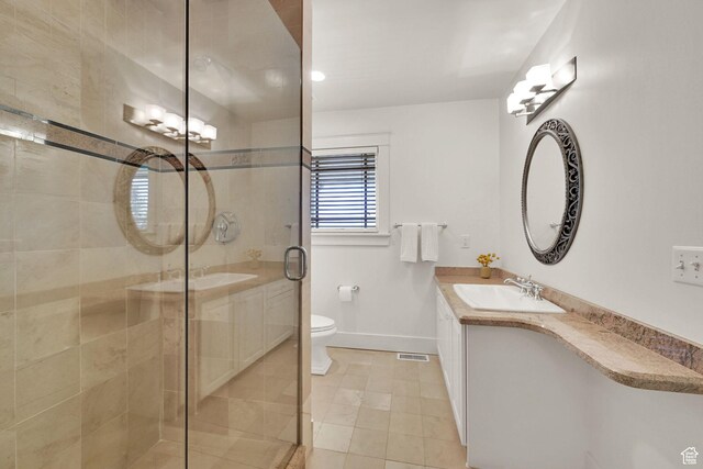 1274 E Chandler, Salt Lake City, UT 84103 - full bath with baseboards, vanity, a shower stall, tile patterned flooring, and toilet