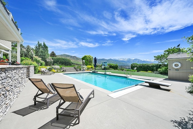 1274 E Chandler, Salt Lake City, UT 84103 - view of pool featuring a mountain view, a diving board, and a patio