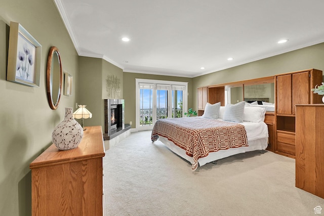 1274 E Chandler, Salt Lake City, UT 84103 - bedroom with carpet floors, crown molding, access to exterior, recessed lighting, and a warm lit fireplace