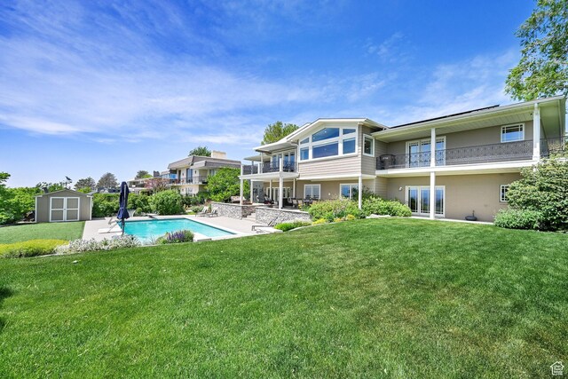 1274 E Chandler, Salt Lake City, UT 84103 - outdoor pool featuring a shed, an outbuilding, a lawn, and a patio area