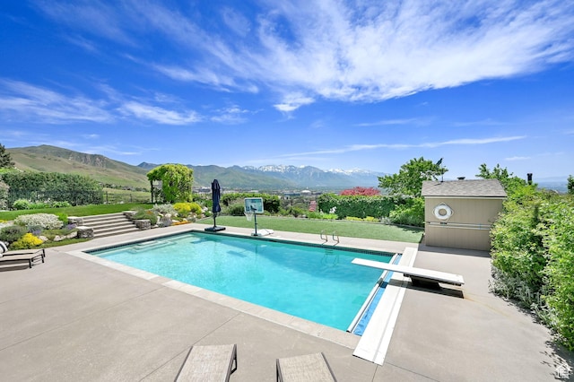 1274 E Chandler, Salt Lake City, UT 84103 - view of pool featuring a mountain view, a diving board, and a patio