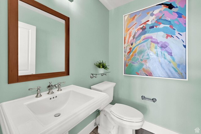 1274 E Chandler, Salt Lake City, UT 84103 - half bathroom featuring a sink, toilet, and baseboards